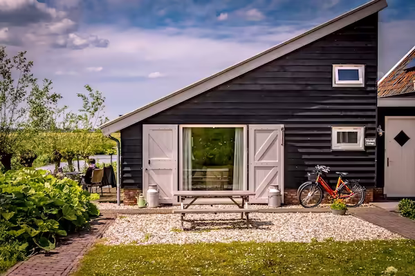 Front of the cottage with a view of the windmill